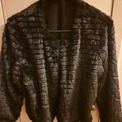 I have for sale like new condition Calvin Klein Size L Cardigan faux fur
