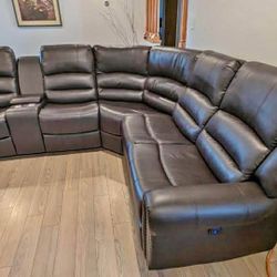 New Reclining Sectional.  Brown Or Black Leather.  111” X 98”.  Free Delivery!