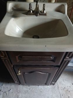 Bathroom vanity with sink and faucet