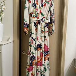 Brand new beautiful floral long dress with tags. Womens size 4 (small). Never worn. smoke free home 