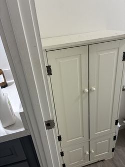 White Cabinet  4ft high and almost 2 ft. wide