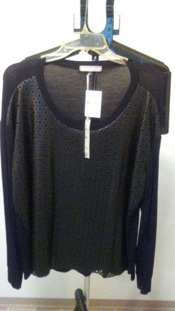 Black long sleeve top with black leather overlay on the front only.