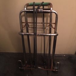 A MIGHTY MINI HAND CART WITH TWO STRETCH CORDS LITE WEIGHT AND STURDY FOLDS UP EASY USED IN GOOD CONDITION $10.00