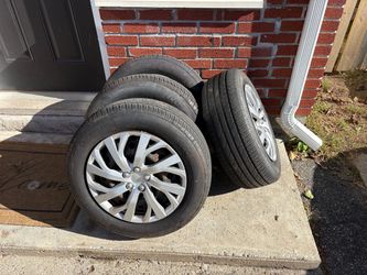 4 tire with rims and hub caps