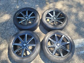 4 20 inch Dub Aftermarket rims with tires attached