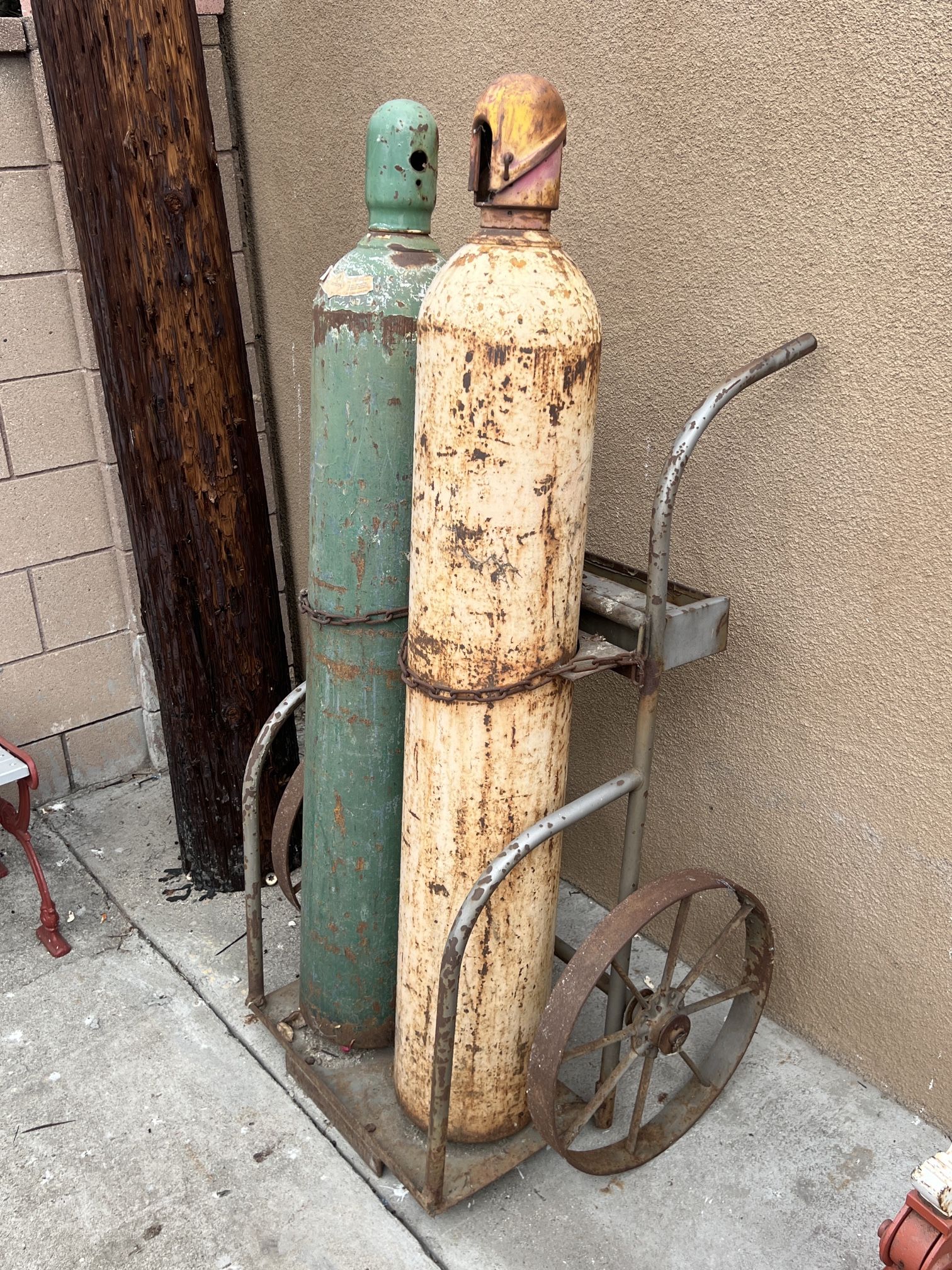 Oxygen and acetylene tanks with cart
