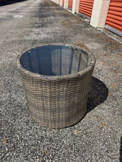 outdoor coffee table made of artificial rattan with tempered glass