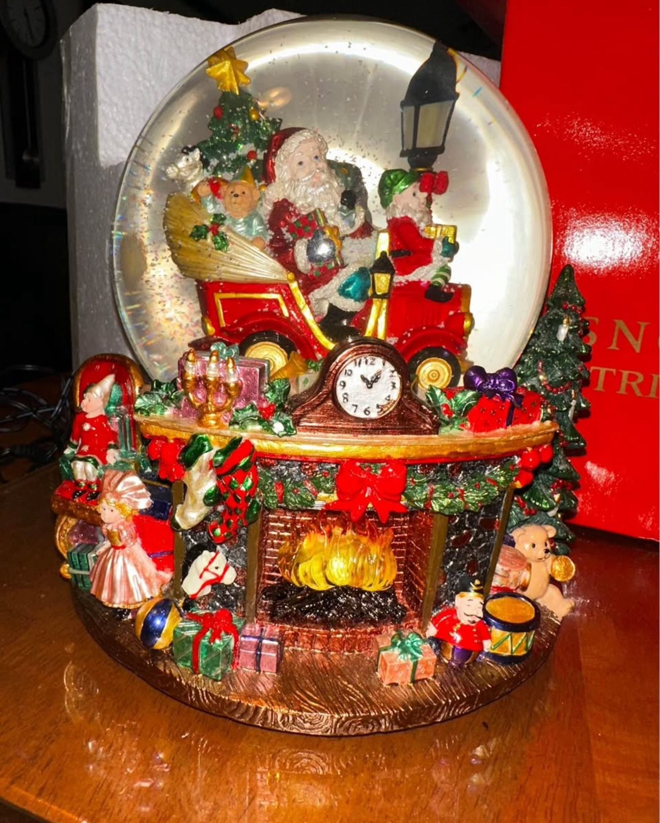 Retired 2000 Christopher Radko Snow Globe. Trim A Tree-O "Jingle Bells" Musical, Light, Blower. #588567 This adorable Christmas scene has a light up f