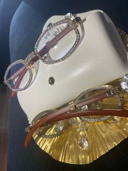 One (1) Millionaire Celebrity Italian Unisex wooden frame with sparkling lab, diamond ice trim. Comes with a white protective case for secure storage.