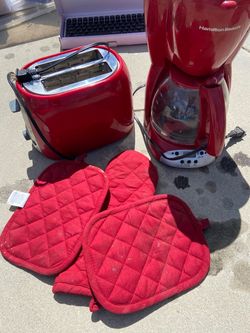 Red toaster, red coffee maker, red oven gloves