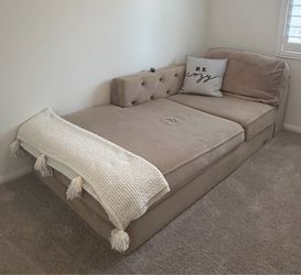 Tan L shaped sectional and ottoman