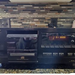 Pioneer PD-F507 25-disc CD changer and a Pioneer VSX-D307 audio/video multi-channel receiver. 