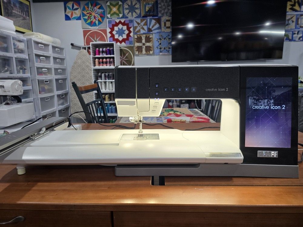 Pfaff Creative Icon 2 . Like New with Warranty, And Cabinet