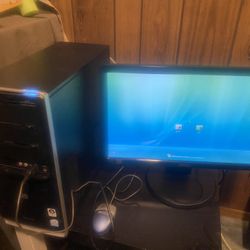 A computer with two monitors and a keypad, all for twenty dollars