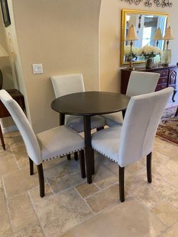 36” dark wood table and 4 upholstered chairs