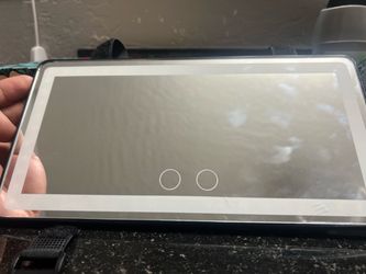 Passenger vanity mirror