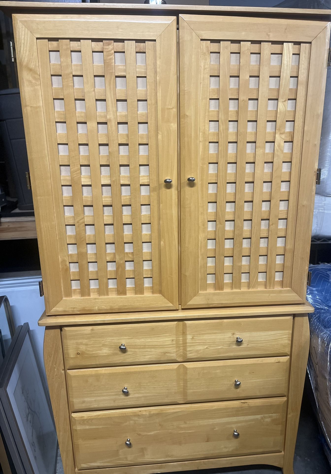 Light wood entertainment armoire