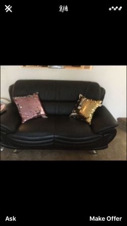 Two leather couches one coffee table and two end tables