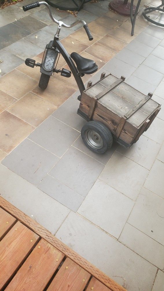Custom-built tricycle with a wooden cargo box attached to the rear