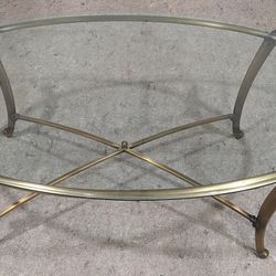 Mid-Century Modern Brass Coloration Coffee Table With Oval Glass Top.