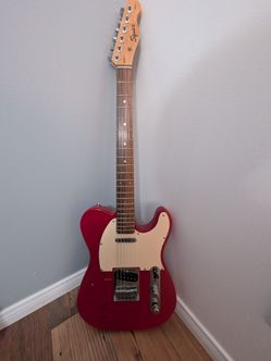 Squire Guitar signed by Carlos Santana.
