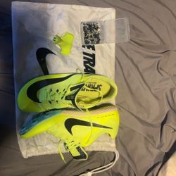 Size 10 Nike Rival Sprint Slikes W/ extra spikes and bag