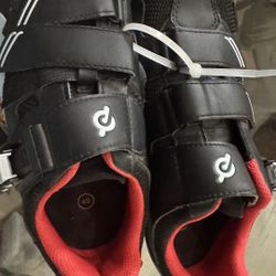 Peloton Cycling Shoes, specifically a black pair with red interior and a size 40