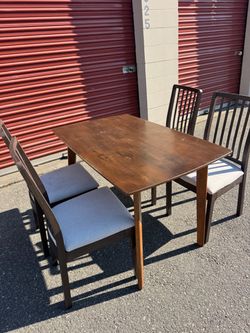 Wooden table and four chairs