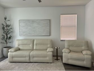Reclining leather couch with recliner sold as a set
