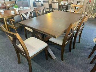 Brand new solid wood dining table with 6 matching chairs (7-piece set).