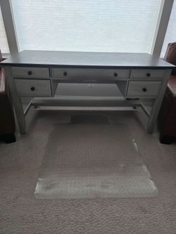 Work/writing Desk featuring a distinctive black top and a white wash base.