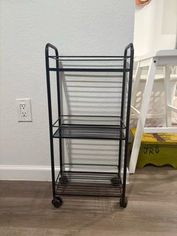 Small shelf with rollers