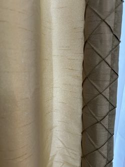 4 panels. 4 tie backs. 2 valances. Lined Curtains made of higher end fabric.  Enough panels for 2 large windows or 4 standard size windows.