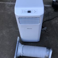 Hisense portable AC  6,000 BTU includes the hose and attached windows