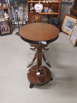 Hard wood stand for decor. Heavy. Maybe flower arrangement