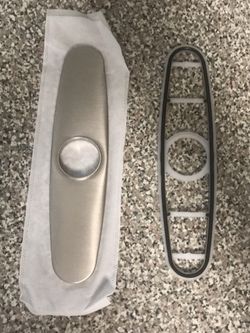 A metal gasket plate for a kitchen faucet Moen brand