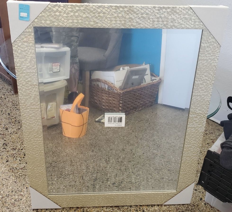 Brand new wall mirror . Covered still in the plastic . 33 inches in height by 27” inches in the width . 45.00 obo