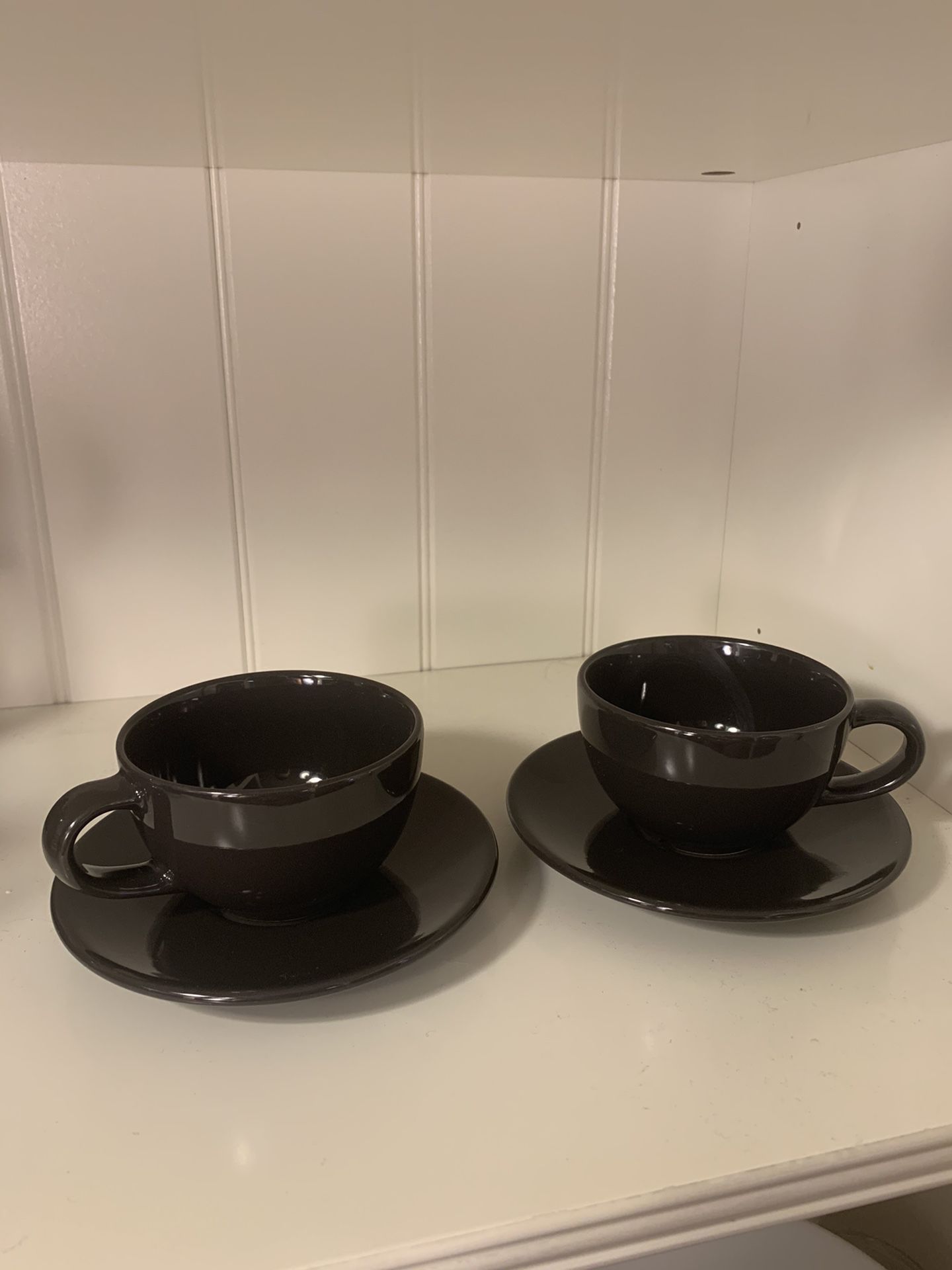 Two tea cups and saucers
