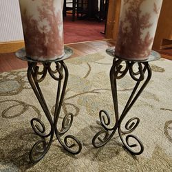 two elegant pillar candles with old candles included