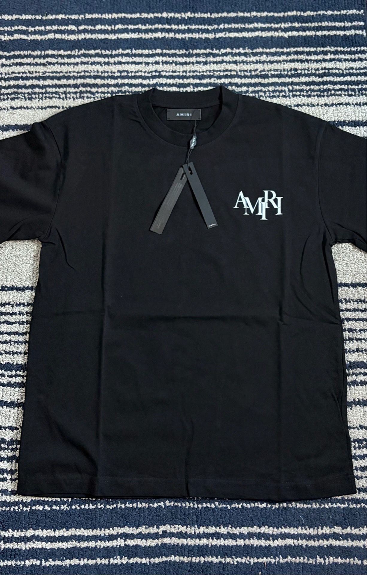 Amari staggered black tee S,M,L,XL