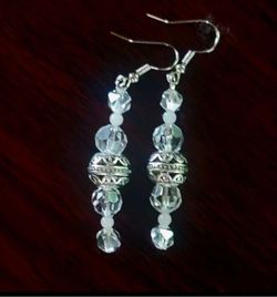CATCH PRISMS OF LIGHT WITH THIS ARTESAN DESIGNED PAIR OF CRYSTAL SWING CHANDOLIER EARRINGS