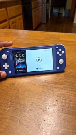 Brand new Nintendo Switch Lite Blue Handheld Console