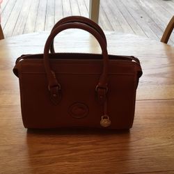 Purse  Dooney Bourke  Vintage Tan . 11 Wide X8 High 5 1/4 Bottom Wide  Very Good Condition .