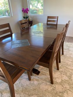 Solid dark wood table and 7 chairs
