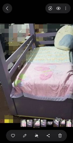 Toddler  bed with storage drawers.