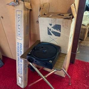 Kodak Carousel slide projector setup featuring a Kodak Carousel projector and slides