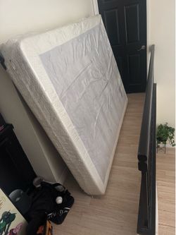 Queen box spring in plastic still