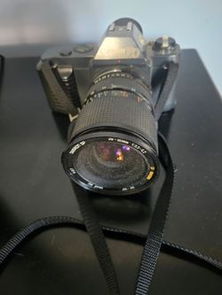 Vintage Canon T50 camera with lense