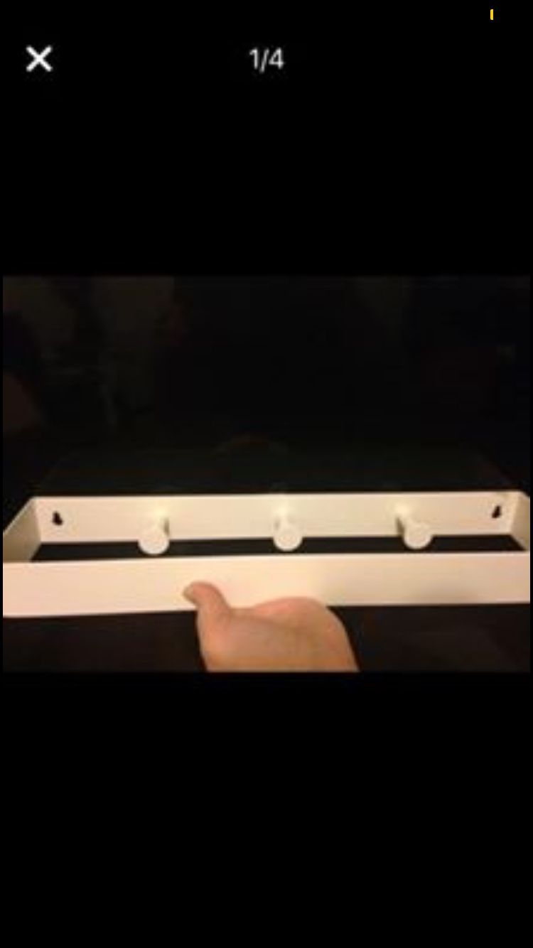 Three knob wall or closet coat or jewelry hanger.
