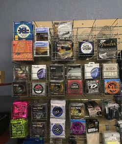 Various guitar strings for musical equipment range in price